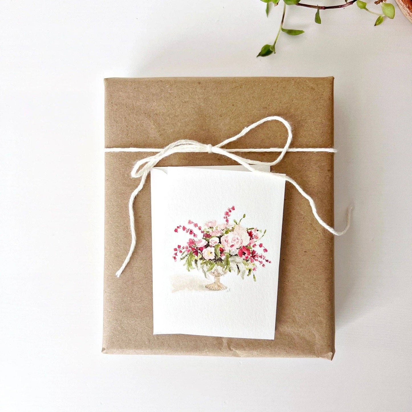 Watercolor illustration of a soft pink floral bouquet printed on premium paper.