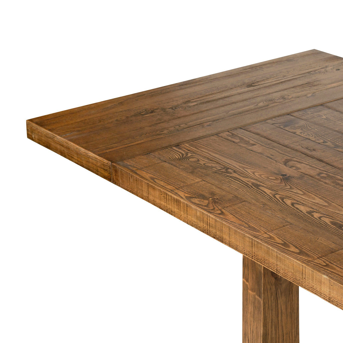 Natural grain, knots and tonal variation in the solid pine of the Foundry Pine Extension Dining Table.