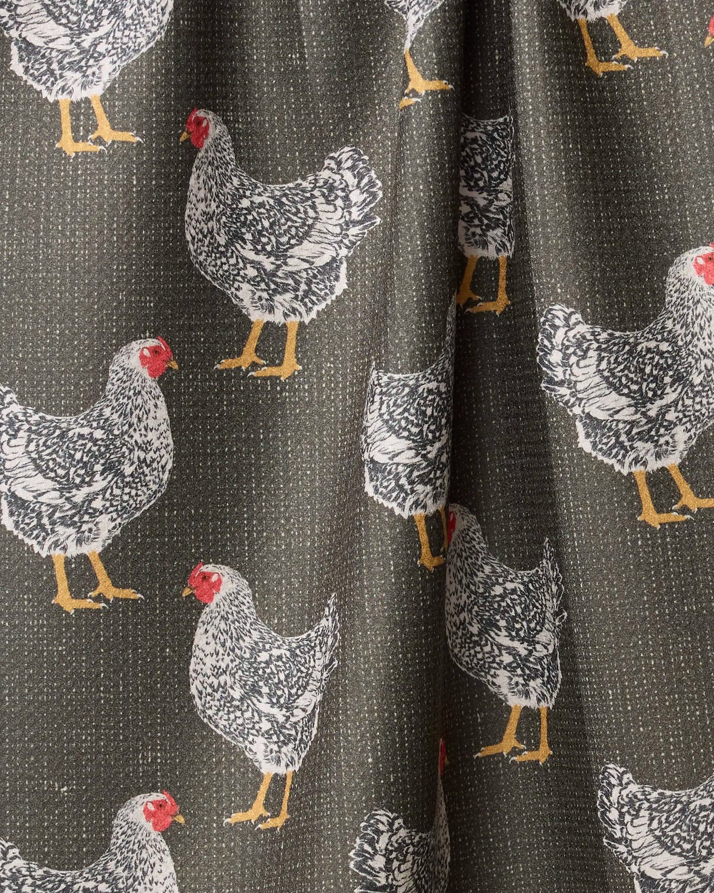 Fabric with chicken pattern on a dark background
