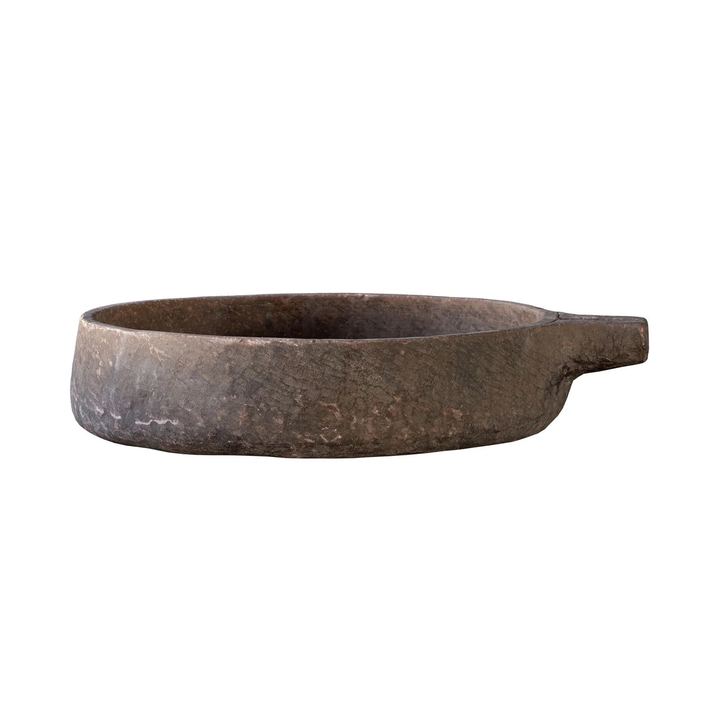 Vintage Stone Kundi bowl carved from sandstone in India with a shallow round form, small spout, and naturally aged patina.