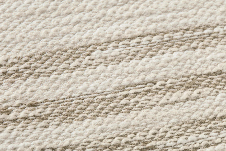 Close-up of the jacquard woven cotton and polyester texture on the Amber Lewis Jay pillow.