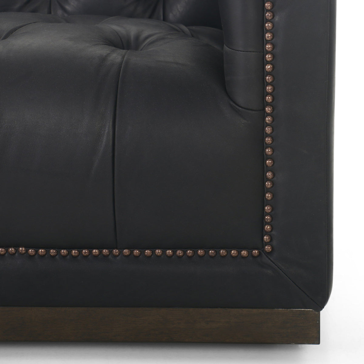 Burnt umber solid parawood base of the Maxx Leather Sofa.