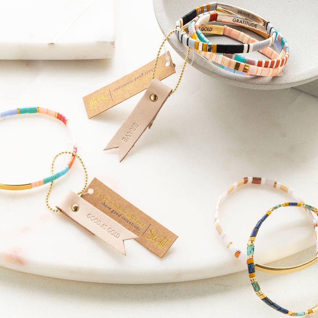 Good Karma Miyuki Bracelet featuring lavender Japanese Miyuki glass beads and a 14K gold-dipped bar engraved with "Be Fierce."