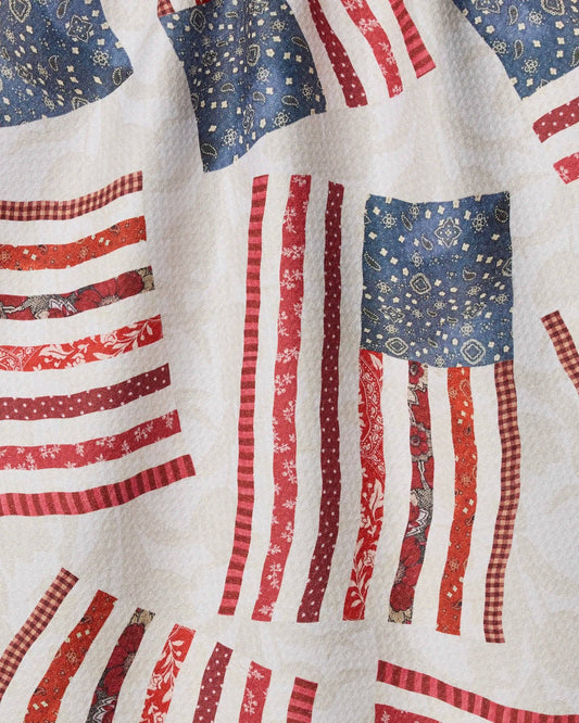 Quilt with patterned American flags on a white background