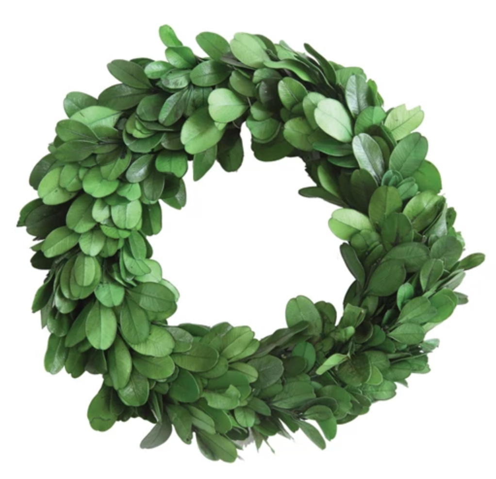 Preserved boxwood wreath featuring lush green foliage and natural texture.