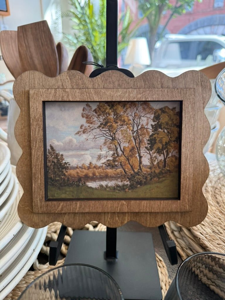 a peaceful autumn landscape in a handcrafted scalloped wood frame with an Early American finish.