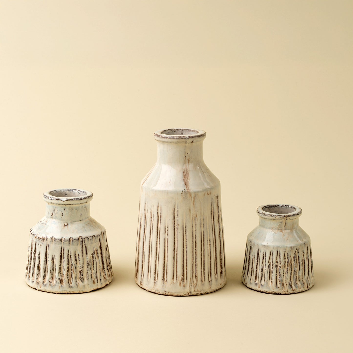Decorative terracotta vase featuring vertical ridge texture and artisan craftsmanship.