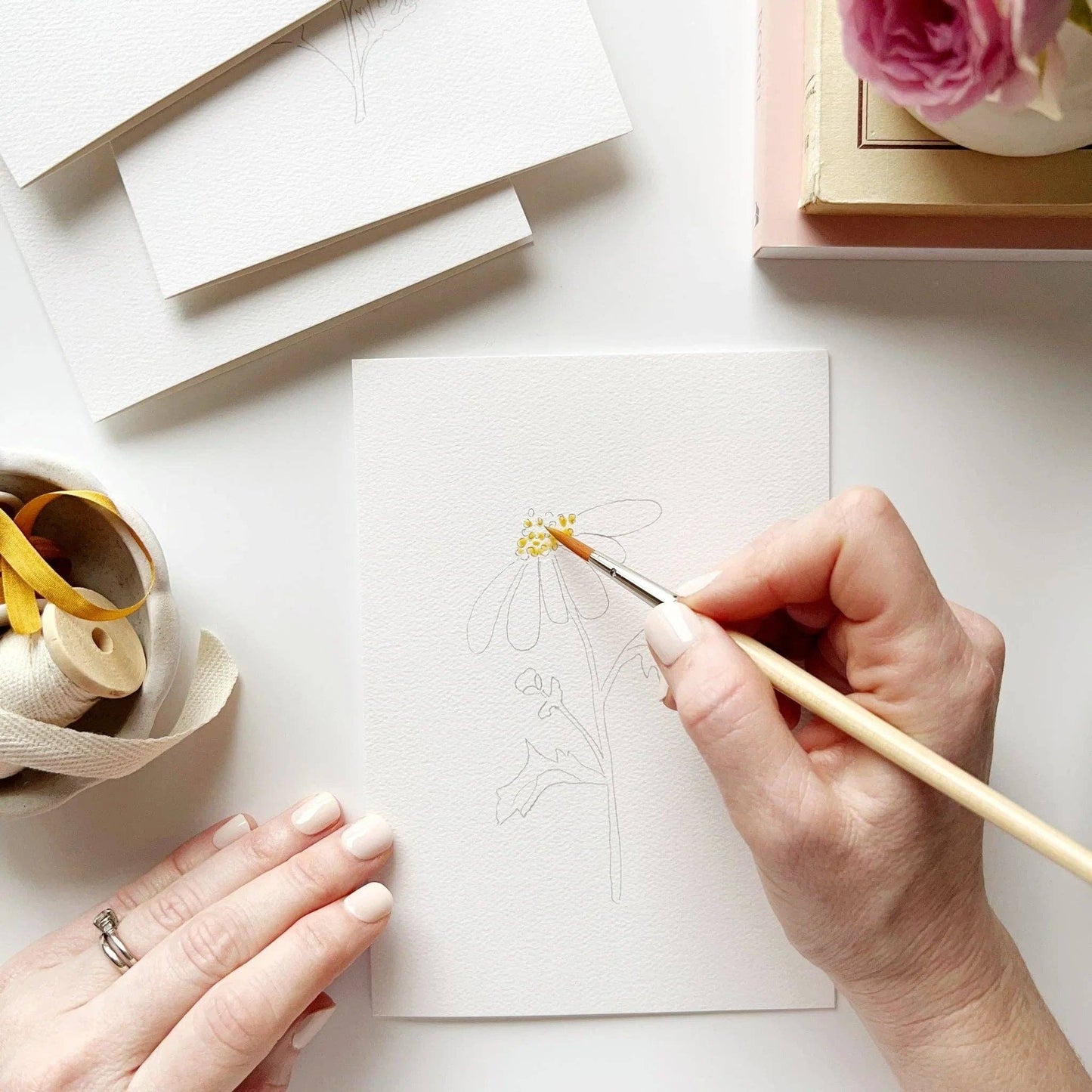 Paintable watercolor notecards featuring hydrangea, garden rose, delphinium, and daisy illustrations.