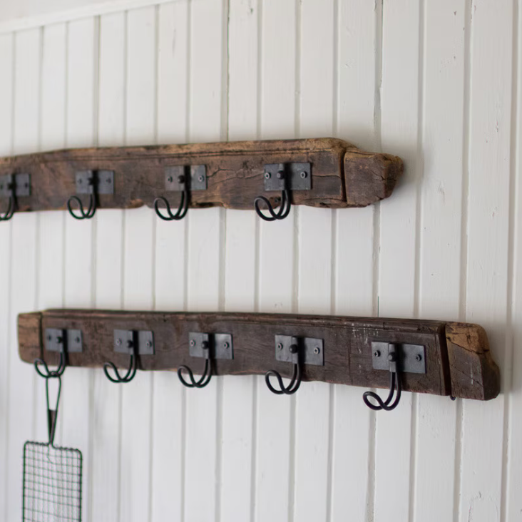 Reclaimed wood coat rack featuring five wire hooks for everyday storage.