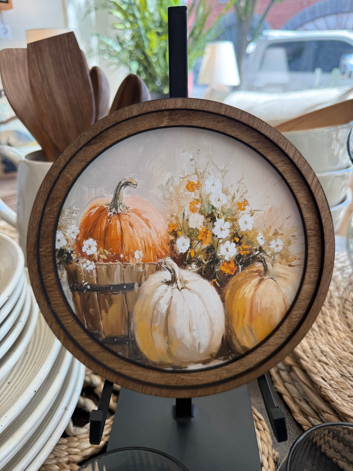 Round Pumpkin Bucket Framed Canvas Art featuring a vintage-inspired pumpkin bucket in a handcrafted round wood frame with an Early American finish.
