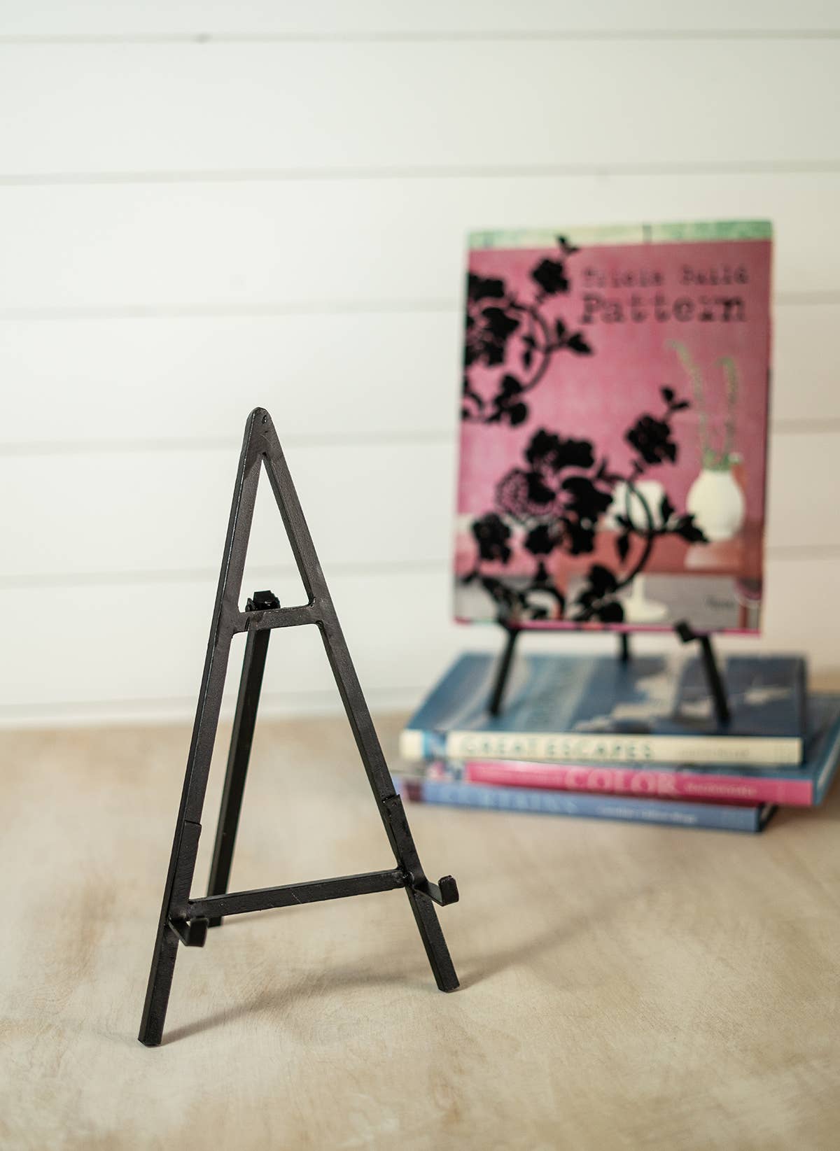 Adjustable iron plate stand designed for tabletop display and measuring up to 14 inches high.