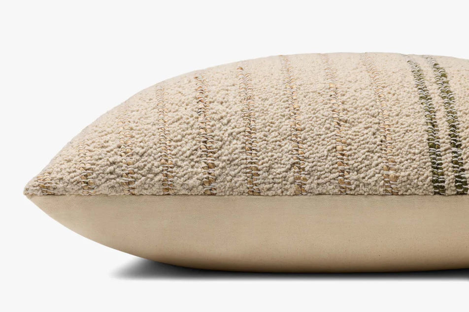 Amber Lewis × Loloi Atley pillow bringing natural texture and earthy olive tones to a thoughtfully curated home.