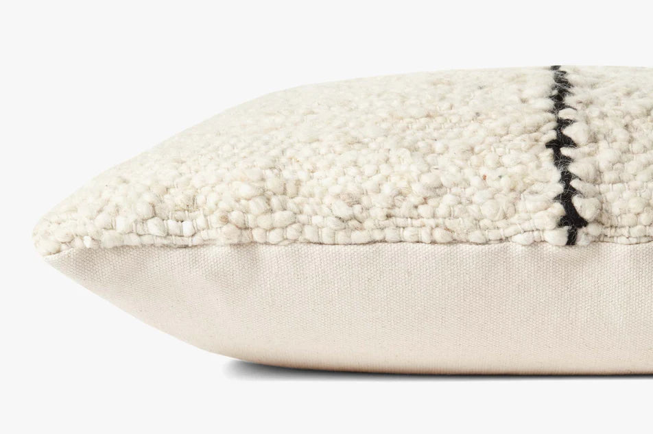 Close-up of the handwoven wool, polyester, and cotton blend with rich texture on the Amber Lewis Carla pillow.