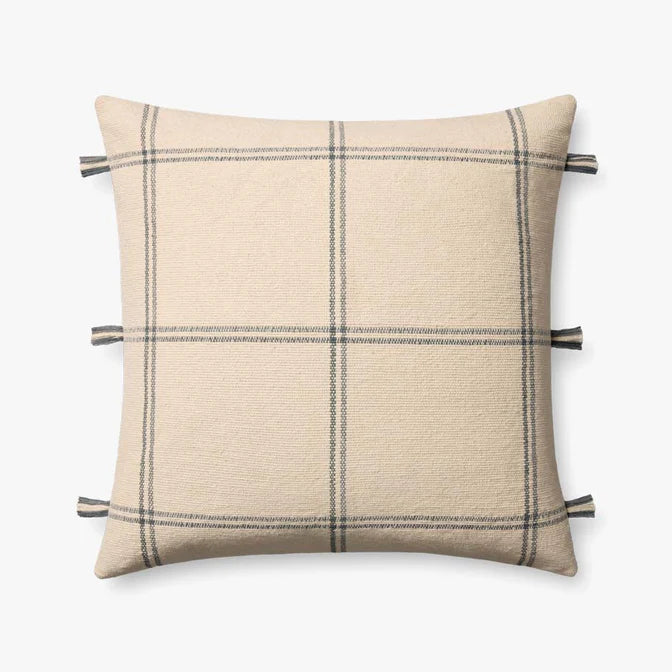 Amber Lewis × Loloi Lainey handwoven throw pillow in natural and blue with fringe edging.