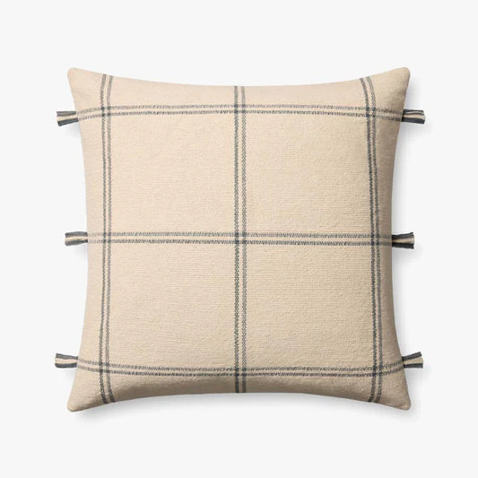 Amber Lewis × Loloi Lainey handwoven throw pillow in natural and blue with fringe edging.