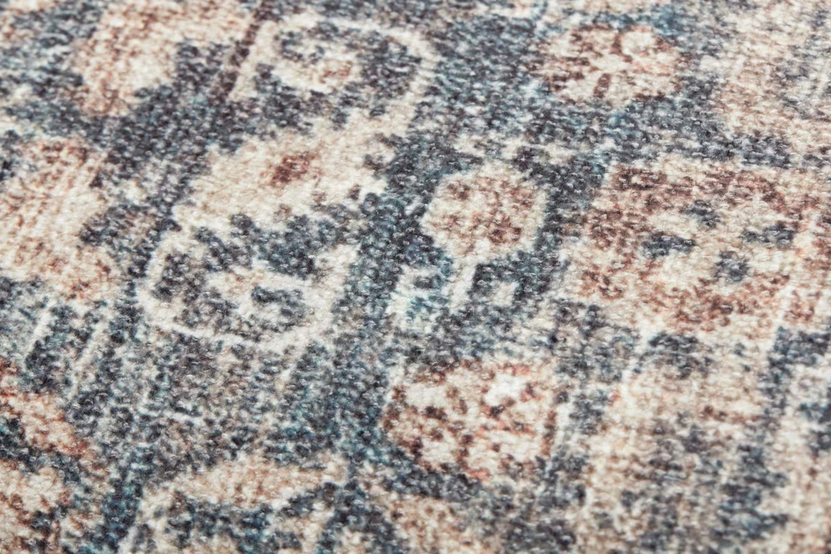 Close-up of the Montara Denim and Natural pillow showing its dimensional machine-woven texture in denim blue and warm neutral tones.