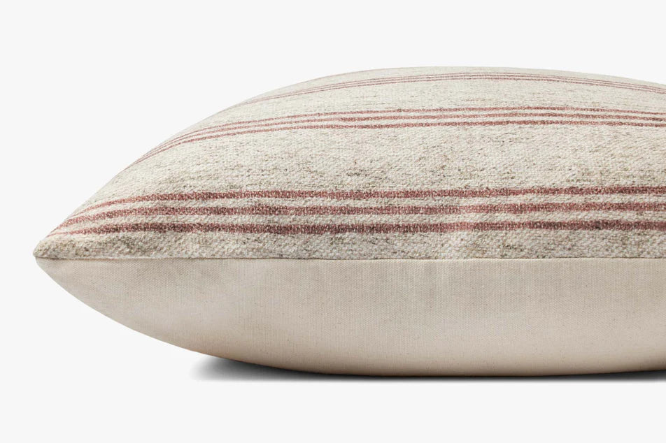 Close-up of the woven polyester and cotton fabric with rich wine accents on the Amber Lewis Zephyr pillow.