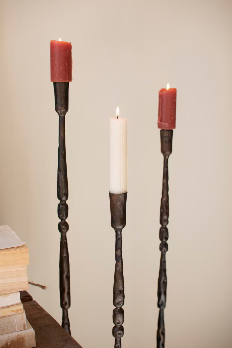 Close-up of the handcrafted forged iron construction and warm antique brass finish.