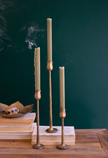 Antique brass candlesticks with a warm, timeless finish for standard taper candles.