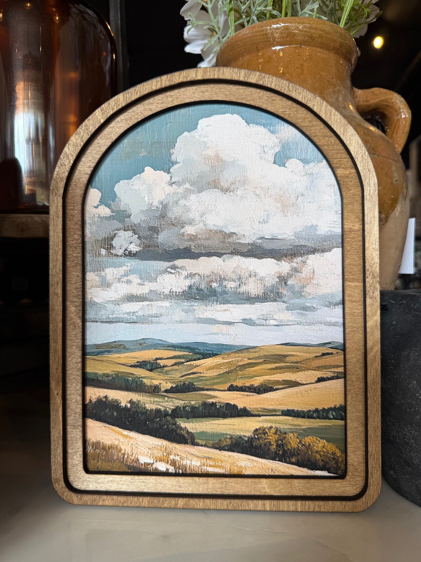 Arch Top Golden Hills Framed Canvas Art featuring a peaceful rolling countryside landscape in a handcrafted arched wood frame with an Early American finish.