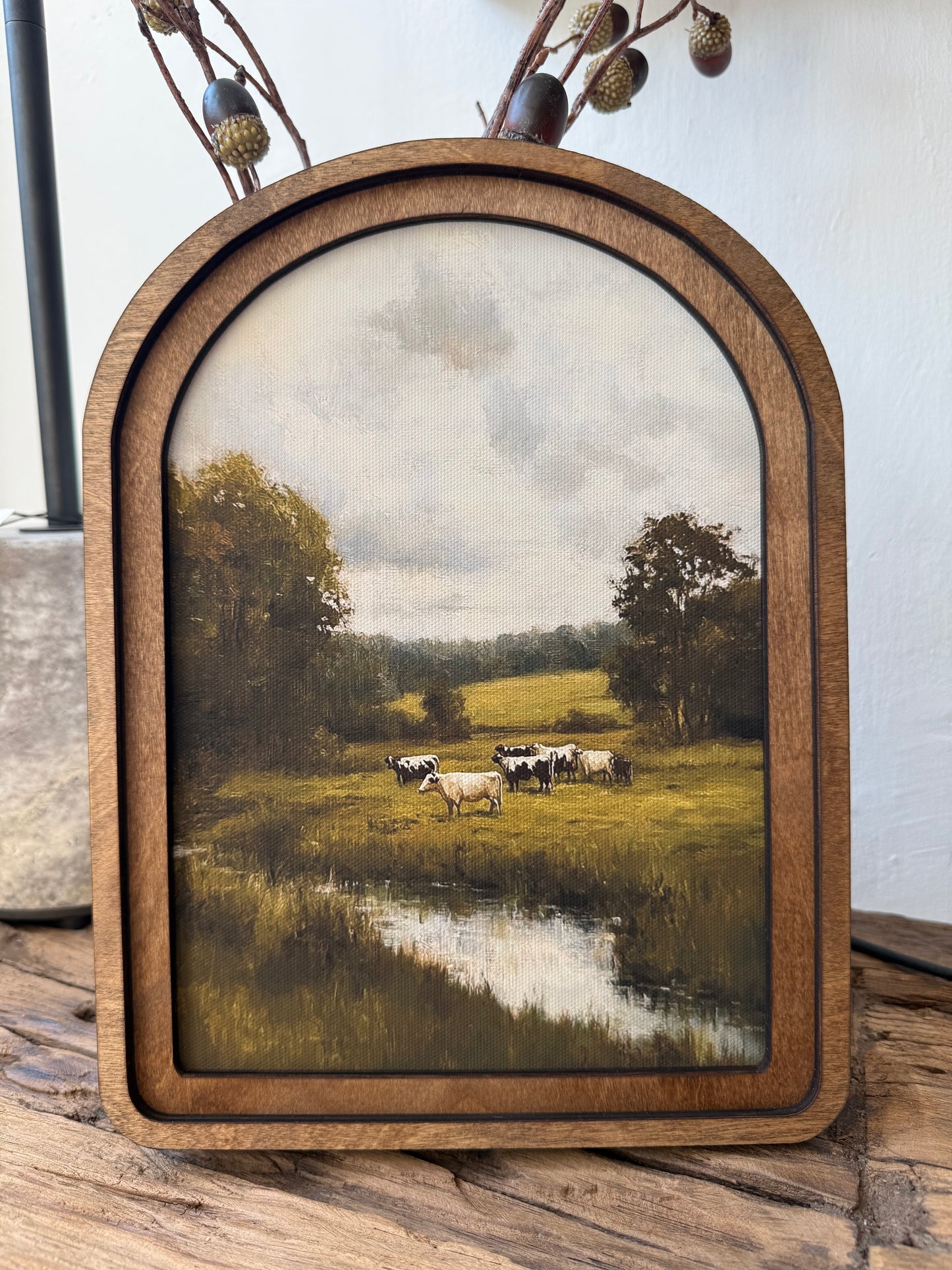 Arch Top Green Pasture Framed Canvas Art featuring a peaceful countryside landscape in a handcrafted arched wood frame with an Early American finish.