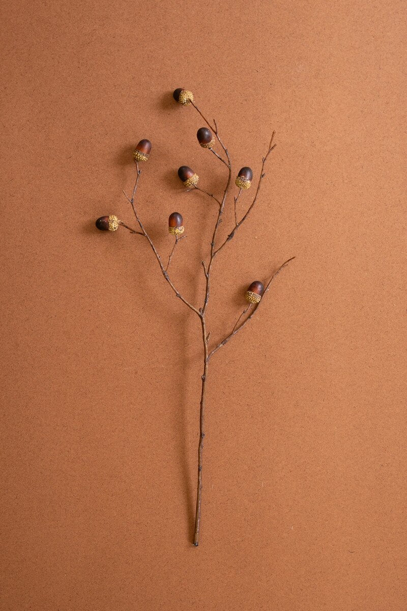Artificial acorn spray featuring realistic miniature acorns on slender branching stems.