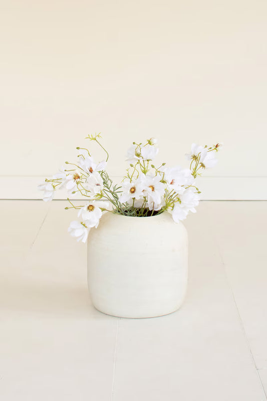 Artificial white cosmos spray featuring delicate white blooms and naturally branching stems.