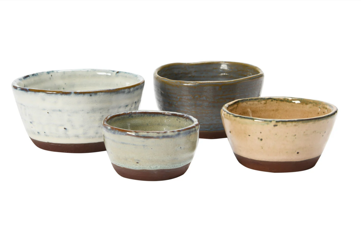 Close-up of the stoneware bowls showcasing reactive glaze texture and handcrafted character.