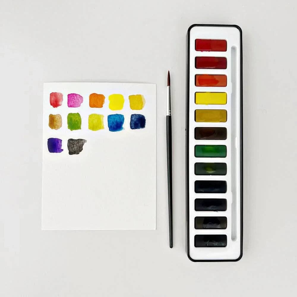 Emily Lex Watercolor Paint Set with 12 vibrant watercolor paints in a portable black tin.