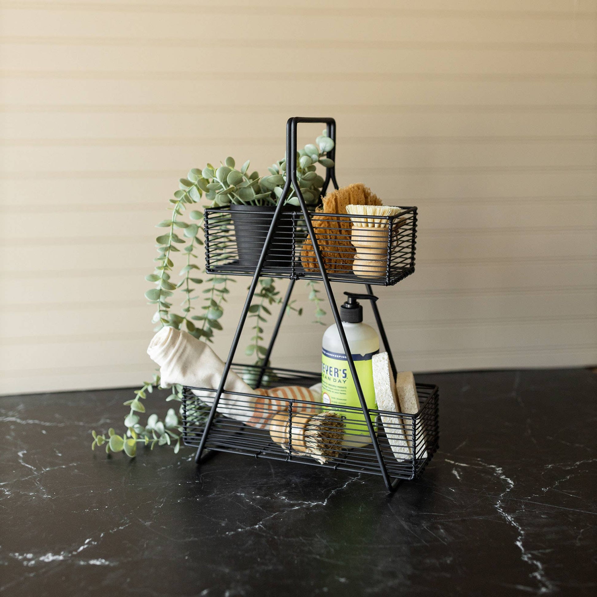 Atticus Two-Tier Wire Basket handcrafted from black metal wire for stylish kitchen, pantry, or bathroom storage.