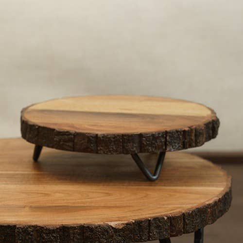 10-inch natural wood serving stand with organic bark edge and raised iron feet.