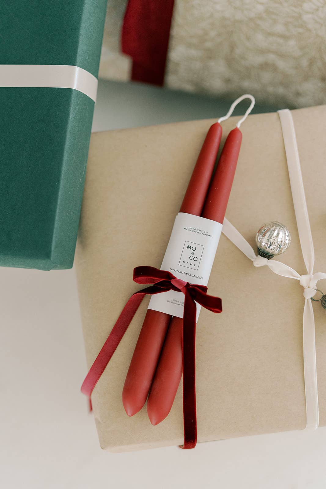 Pair of berry red beeswax taper candles with a classic slender silhouette and handcrafted finish.