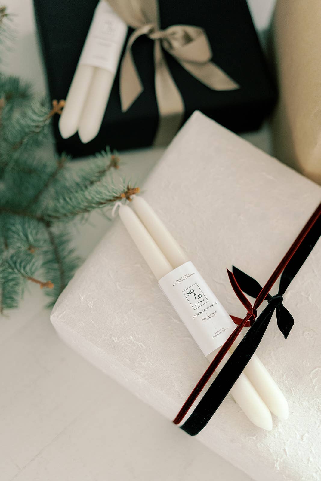 Pair of natural white beeswax taper candles, hand-dipped from 100% pure beeswax with cotton wicks.
