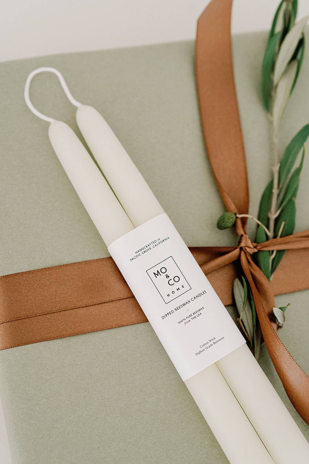 Pair of natural white beeswax taper candles, hand-dipped from 100% pure beeswax with cotton wicks.