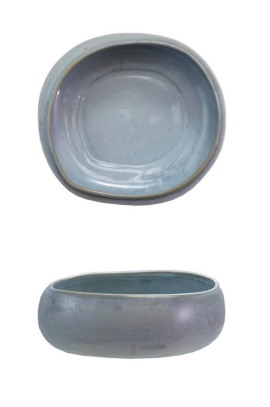 Blue reactive glaze stoneware bowl featuring an organic shape and artisan-crafted finish.
