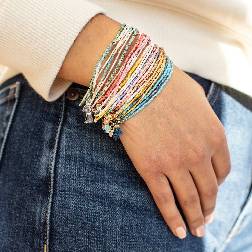 Chromacolor Miyuki Bracelet Trio paired with layered gold jewelry and neutral accessories, creating a modern, curated everyday style.