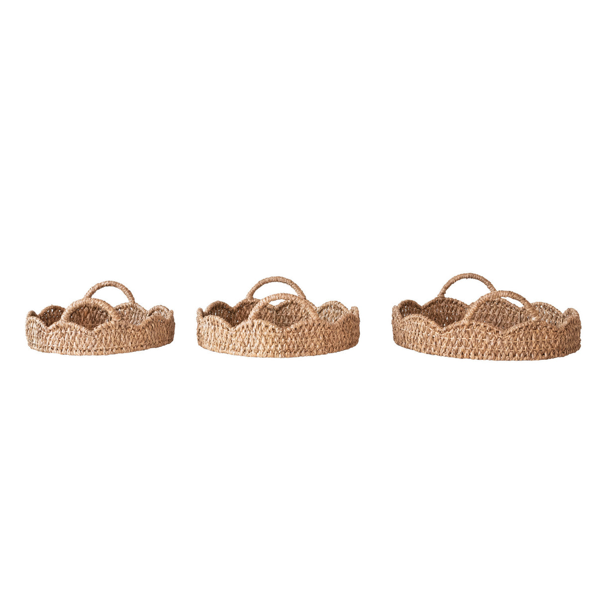 Three sizes of natural braided bankuan and rattan trays with scalloped edges and integrated handles.