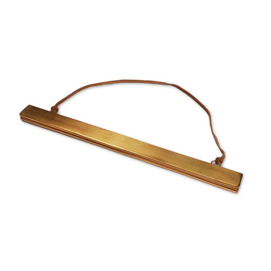 Brass magnetic strip frame featuring a warm metallic finish and minimalist design.