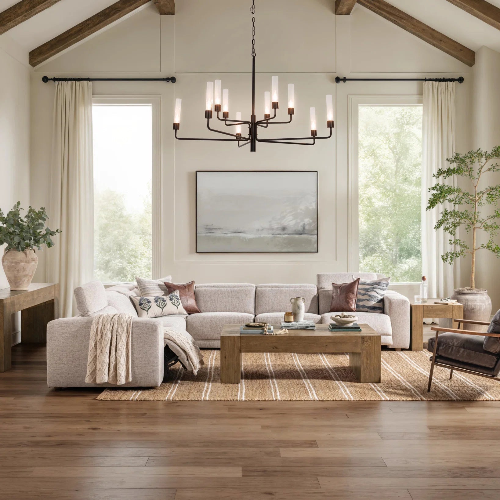 Bristol reclaimed oak coffee table styled in an organic modern living room with linen seating, stone accents, and layered natural textures.