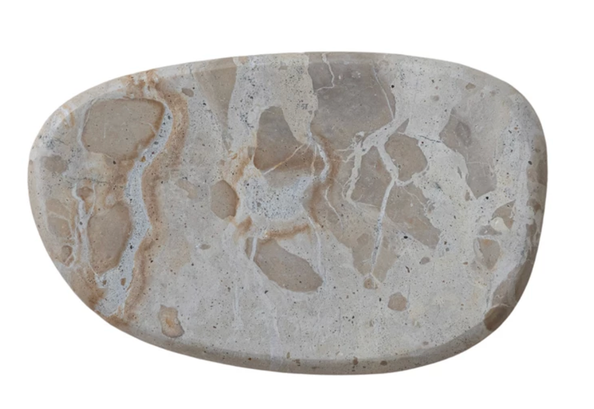 Buff marble cheese and serving board crafted from natural stone with warm butterscotch tones and unique veining.