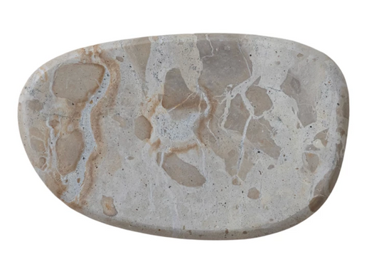 Buff marble cheese and serving board crafted from natural stone with warm butterscotch tones and unique veining.