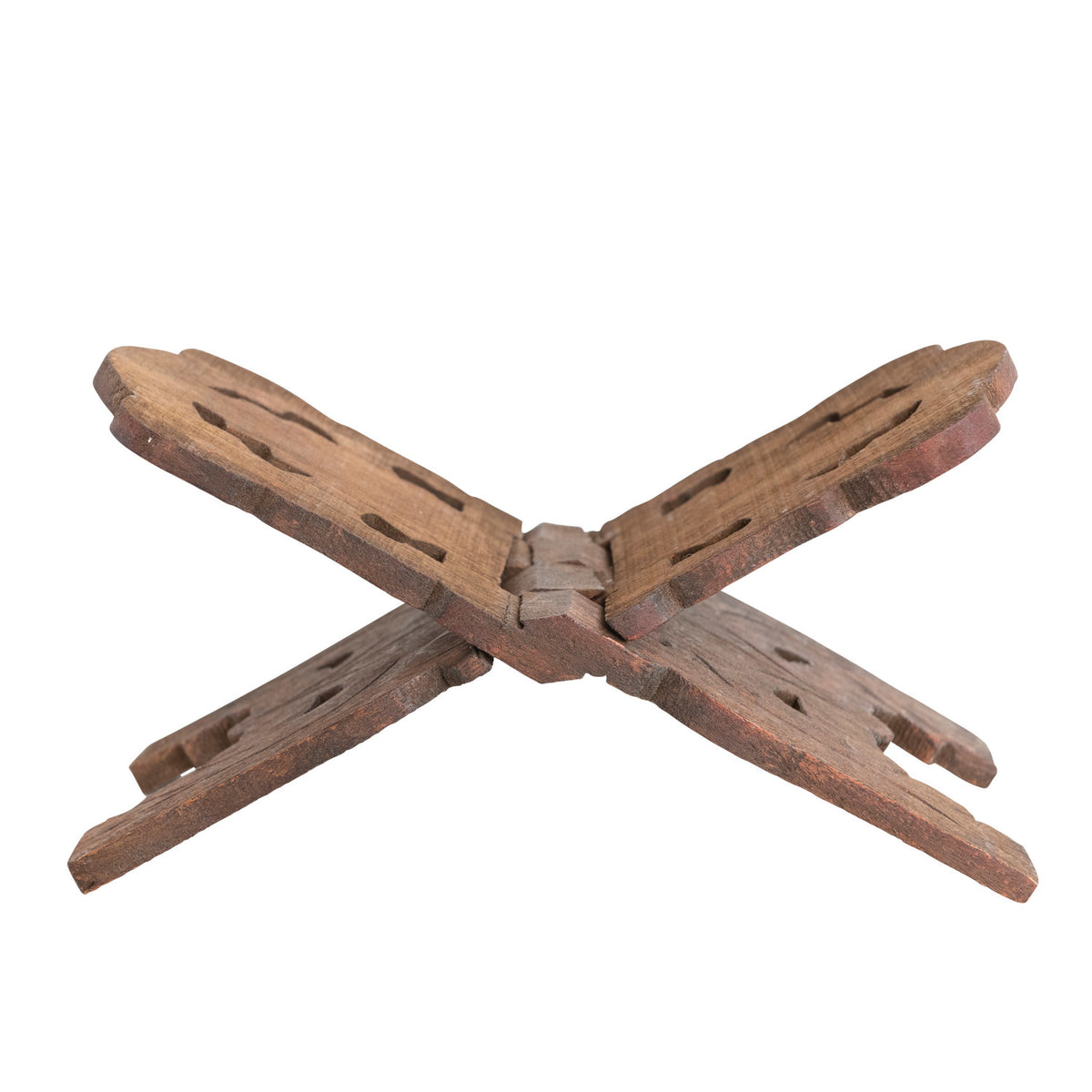 Angled view of the interlocking reclaimed wood book stand showing its folding construction and hand-carved details.