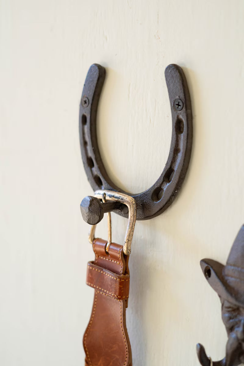 Cast iron horseshoe wall hook with a rustic antique finish inspired by Western ranch style.