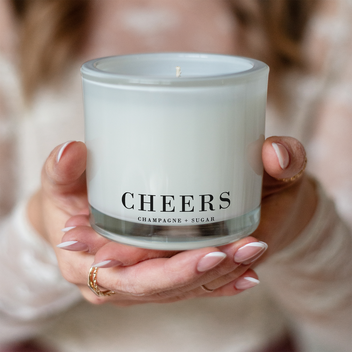 Cheers Champagne + Sugar 9 oz coconut wax candle in a frosted glass jar with clean-burning cotton wick and luxury gift-ready packaging.