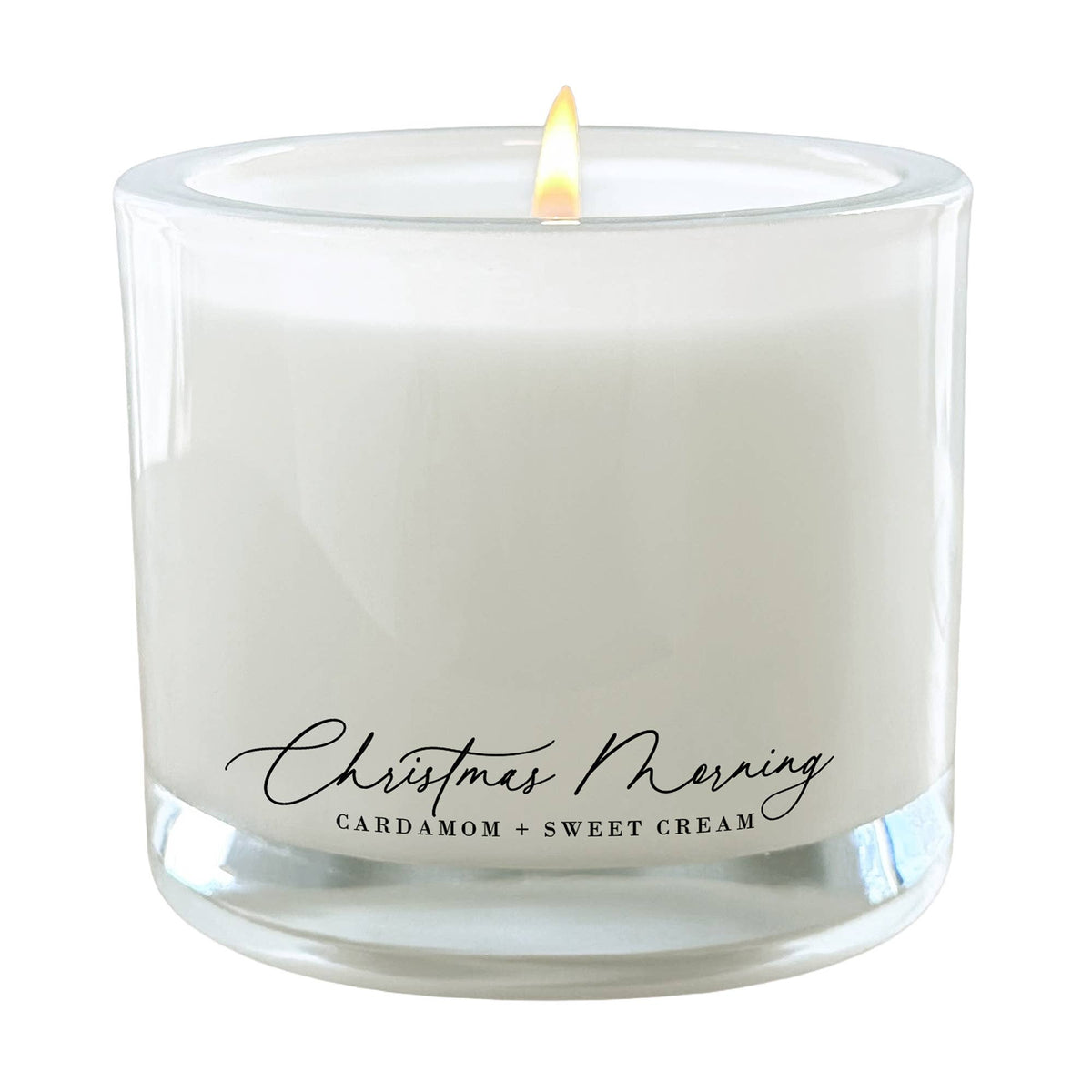 Christmas Morning Cardamom + Sweet Cream 9 oz coconut wax candle in a frosted glass jar with luxury gift-ready packaging.