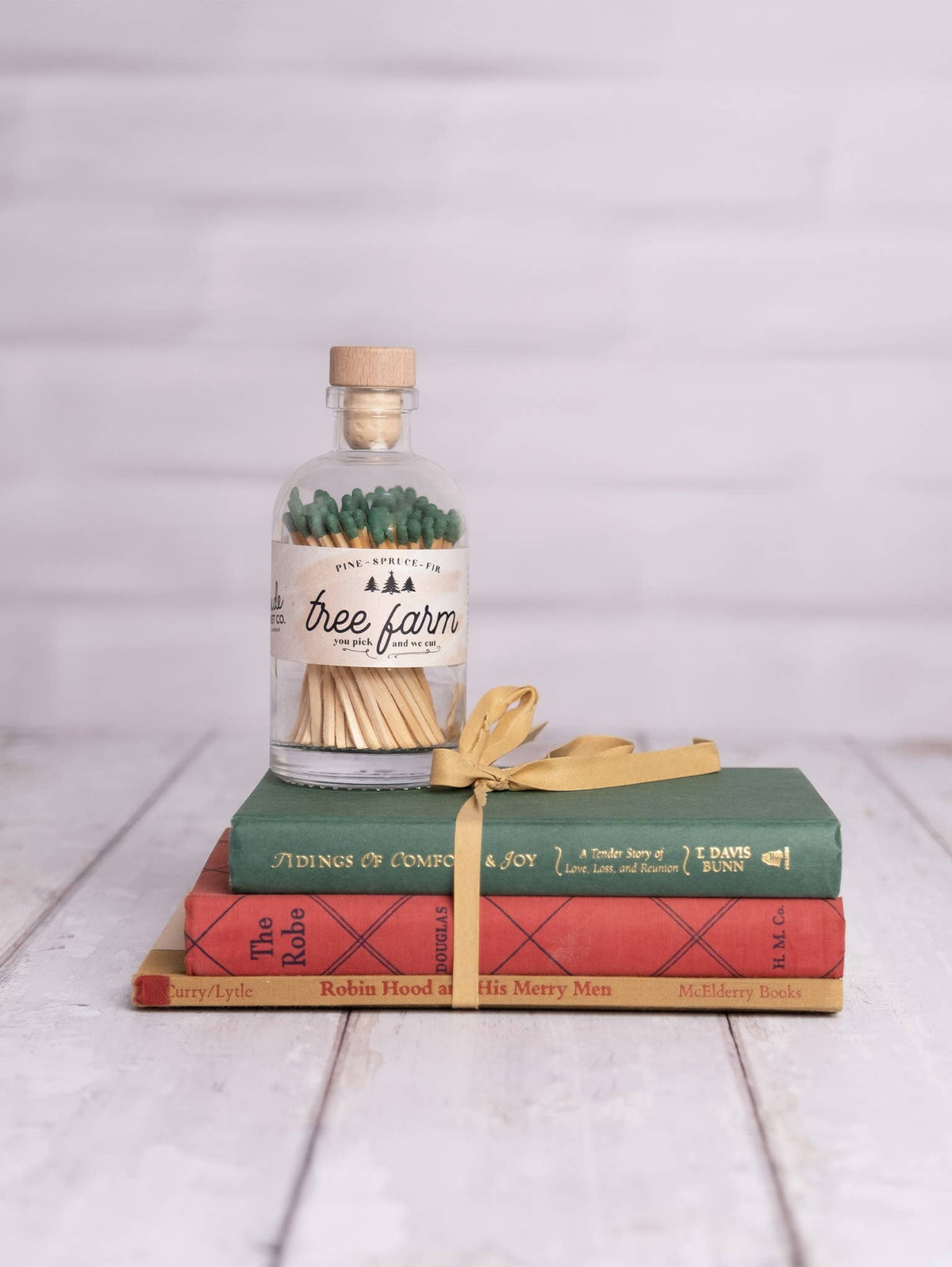 Christmas Tree Farm vintage apothecary matches in a glass jar with olive green match tips and wooden cork lid.