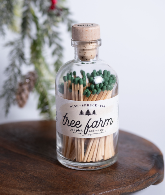 Christmas Tree Farm vintage apothecary matches in a glass jar with olive green match tips and wooden cork lid.
