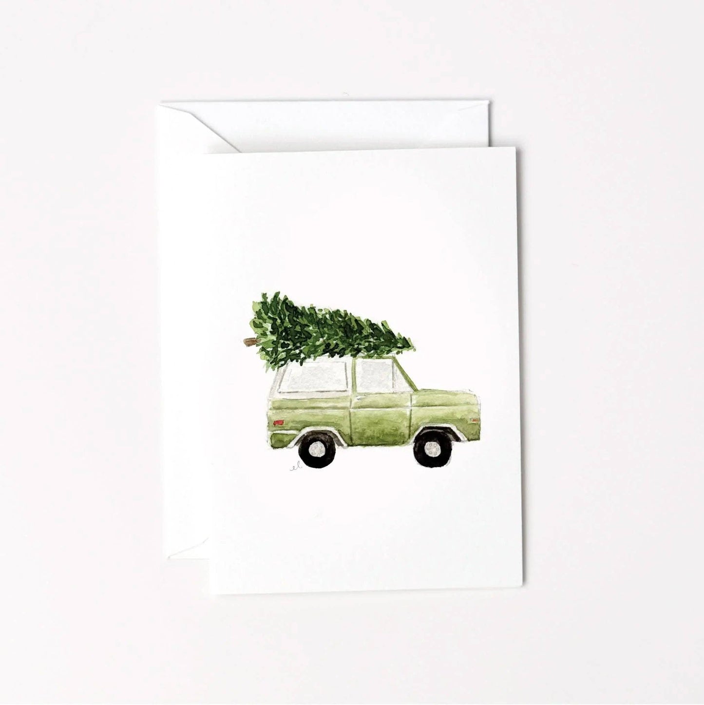 Christmas Tree Truck Mini Enclosure Card by Emily Lex featuring an original watercolor illustration of a vintage truck carrying a Christmas tree.