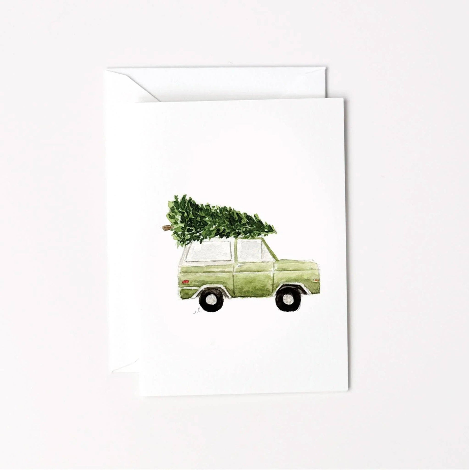 Christmas Tree Truck Mini Enclosure Card by Emily Lex featuring an original watercolor illustration of a vintage truck carrying a Christmas tree.