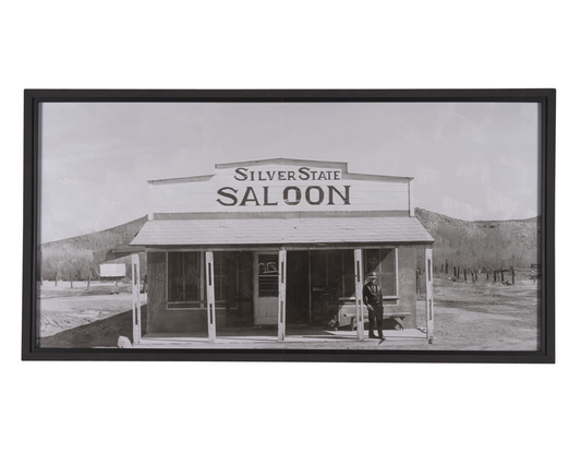 Cooling Your Heels framed art print featuring a historic Western saloon in black and white photography.